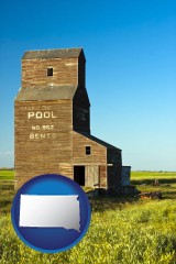 south-dakota map icon and an old grain elevator
